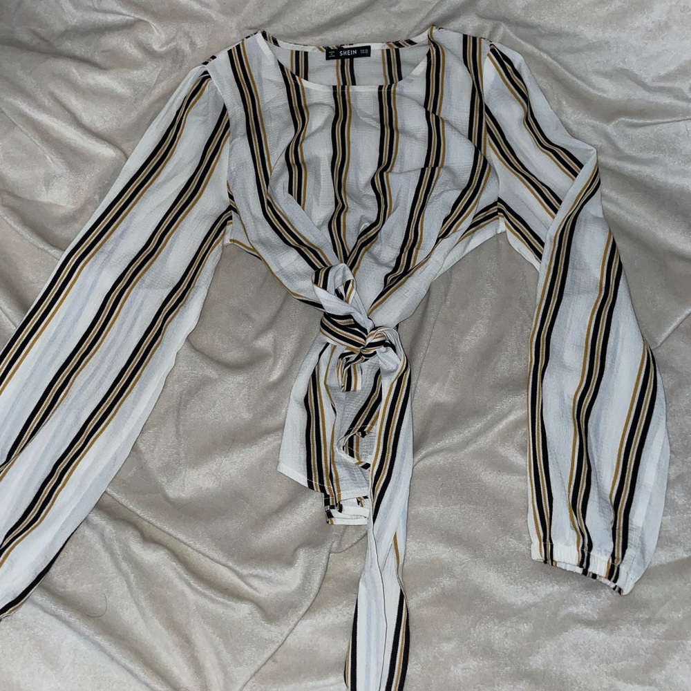 White, black, and yellow blouse with a tie in the mid-section